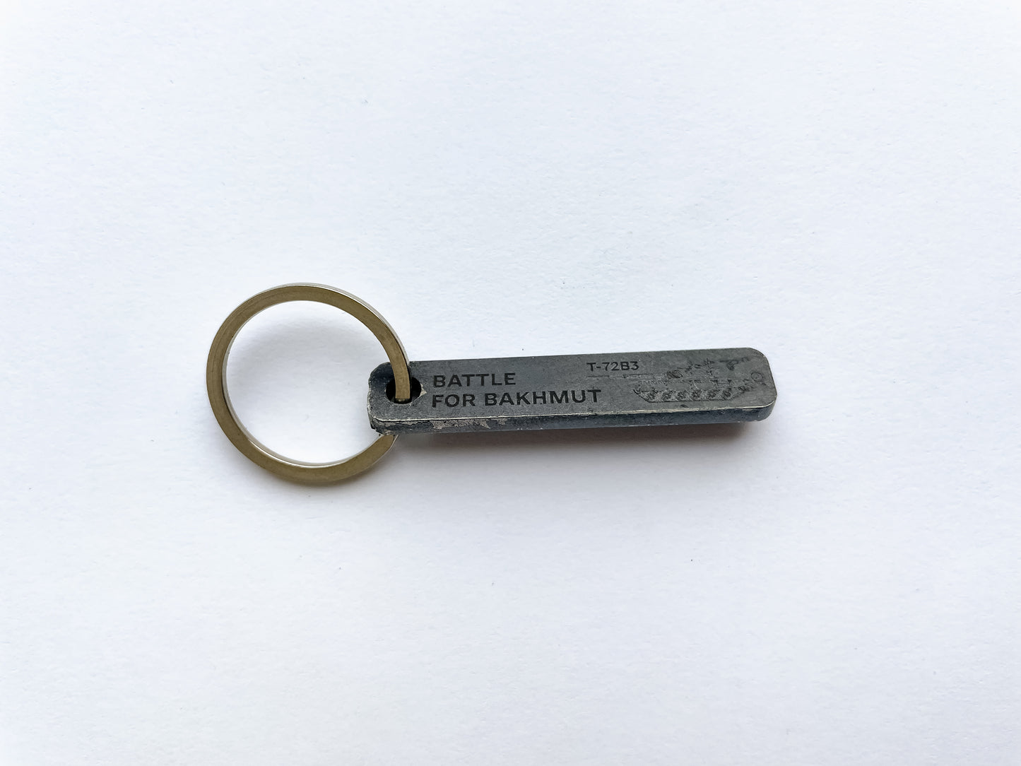 Keychain made from a piece of a damaged russian T-72 tank